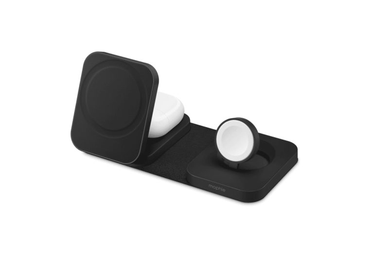 Mophie 3-in-1 MagSafe travel charger with iPhone, Apple Watch, and AirPods charging on a hotel nightstand