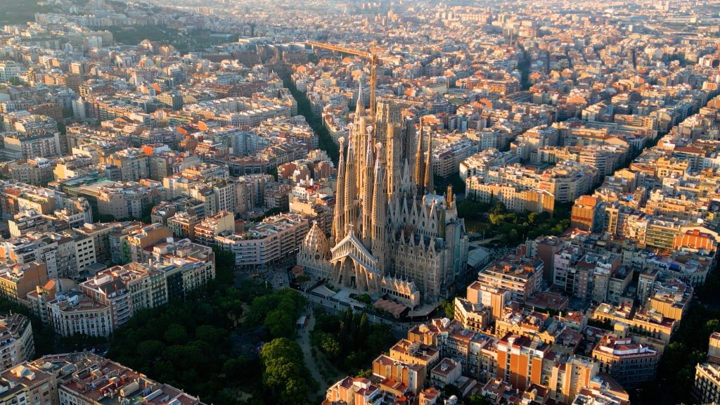 A stunning view of Barcelona’s Sagrada Familia basilica against a vibrant blue sky.